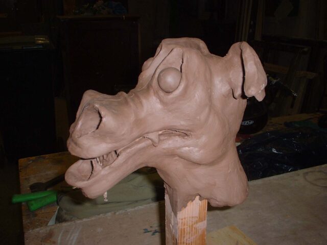 A clay model for a dragon hand puppet, commissioned as a stage prop Clay model dragon head